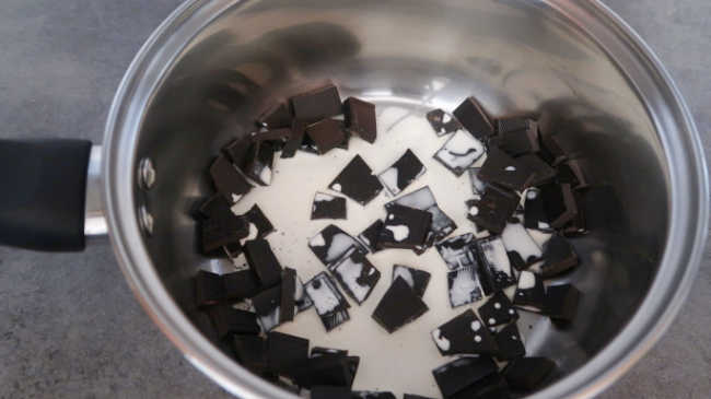 Cream and chocolate in a saucepan