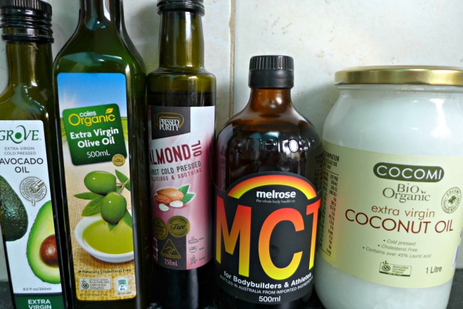 A selection of low carb ketogenic fats - avocado oil, olive oil, almond oil, MCT oil and coconut oil