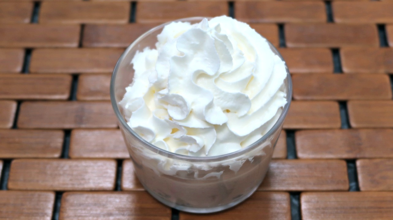 Low carb peanut butter mousse topped with whipped cream