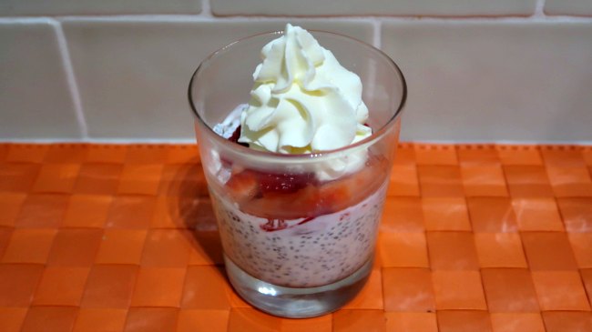Keto Chia Pudding topped with strawberries and whipped cream