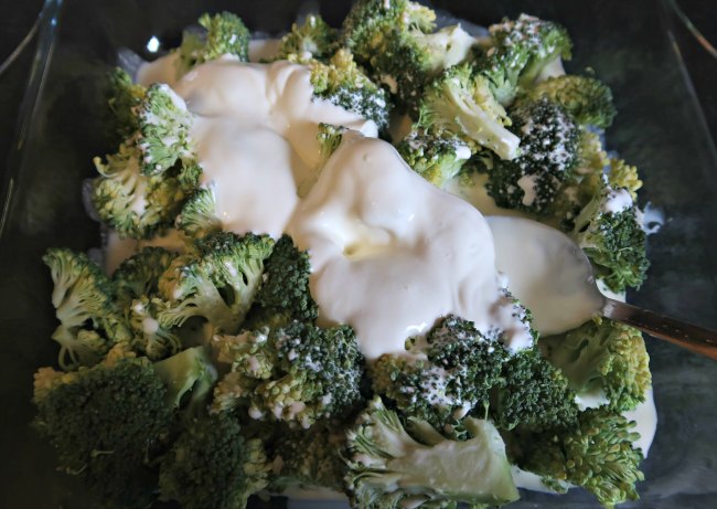 Broccoli covered with cream and sour cream