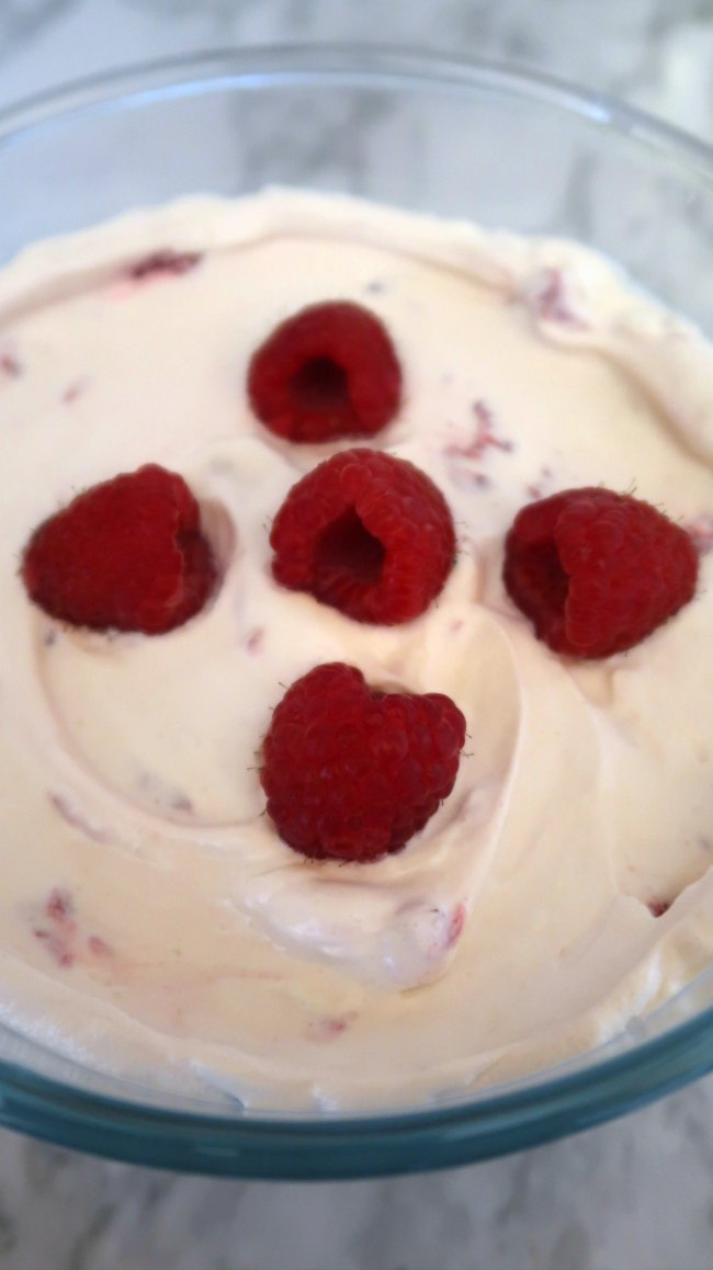 Keto Raspberry Mousse topped with fresh raspberries