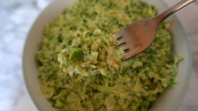 Fork with cheesy broccoli rice