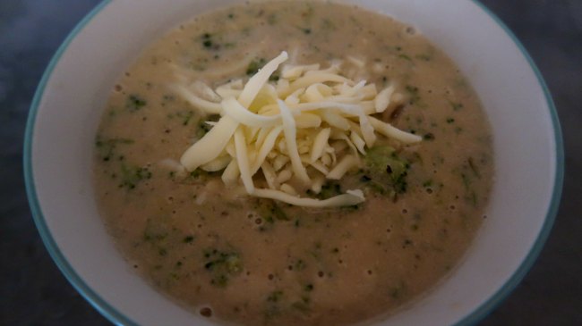 Best broccoli cheese soup in a bowl topped with more cheese - lazy keto meals