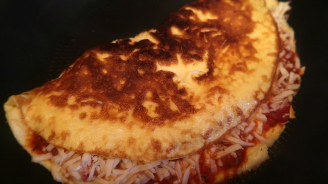 Keto Pizza Omelette in a frying pan