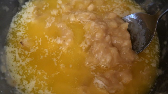 Mixing butter and mashed banana