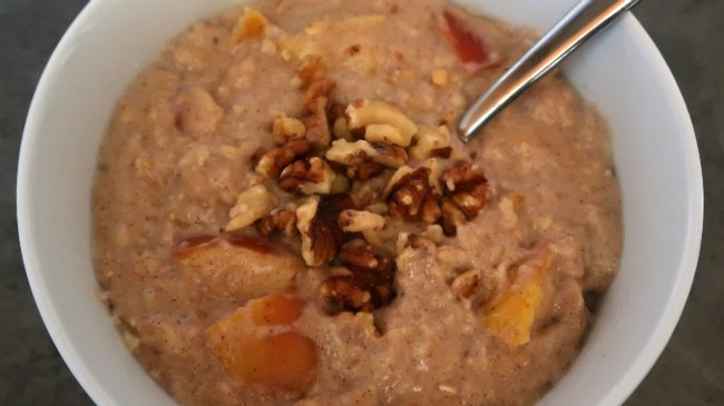 Bowl of apple cinnamon oatmeal with walnuts on top