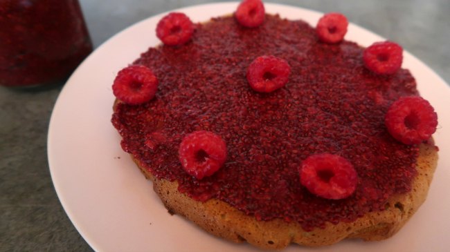 Gluten Free Sponge Cake topped with raspberries and jam