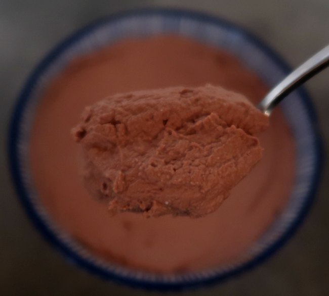 Spoon of low carb chocolate ricotta mousse