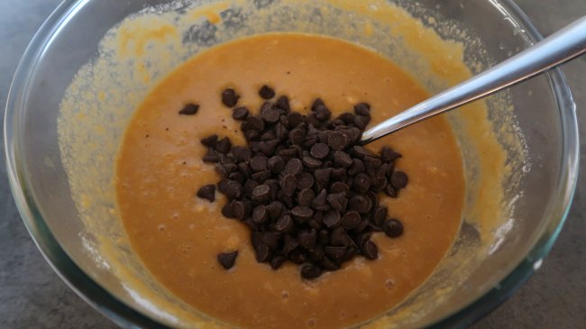 Mixing chocolate chips into the batter