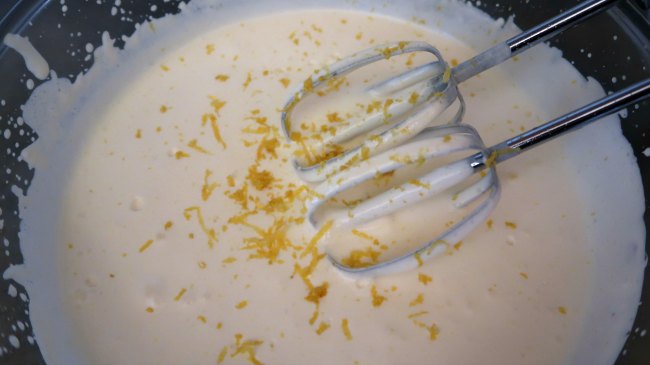 Mixing lemon zest and juice into mousse