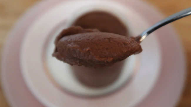 Spoon of chocolate panna cotta