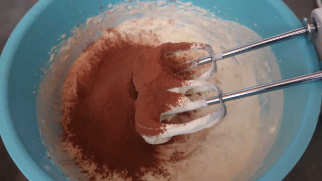 Adding cocoa powder into chocolate mascarpone frosting