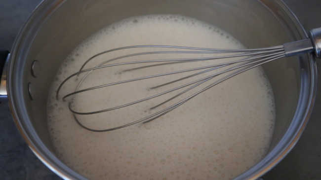 Whisking ingredients together for coconut panna cotta recipe