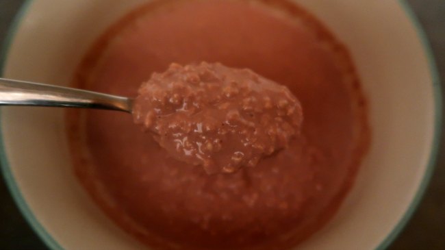Spoon of decadent chocolate overnight oats