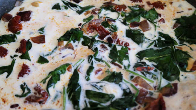 The simple ingredients for the easy recipe including fresh spinach and sun-dried tomatoes