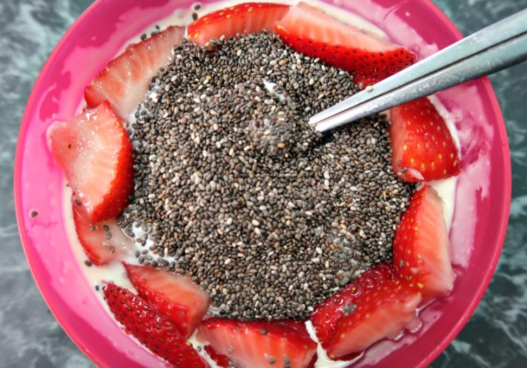 Chia pudding topping with fresh strawberries