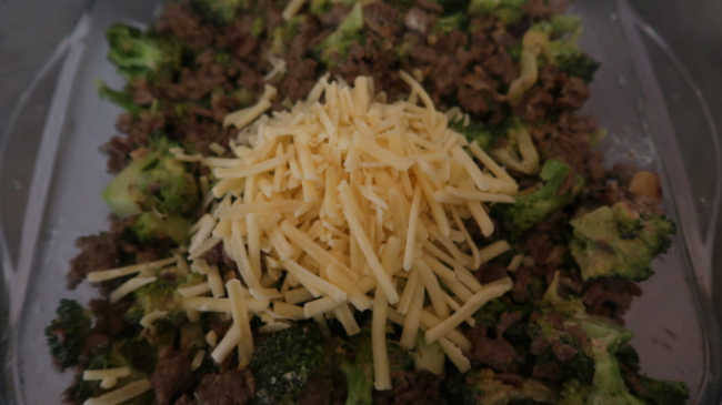 Topping the easy recipe with grated cheese