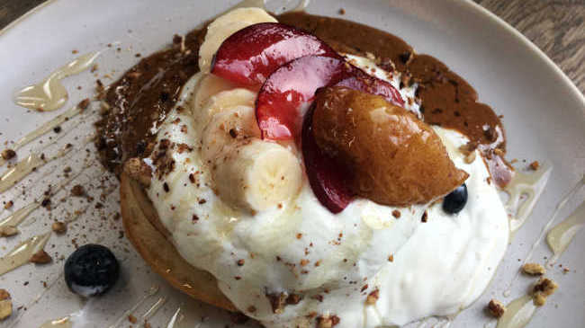 Fluffy gluten free pancakes topped with fresh fruit