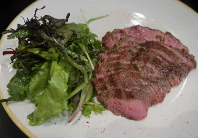 Plate with steak and salad