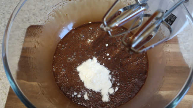 Adding coconut flour to the brownie batter