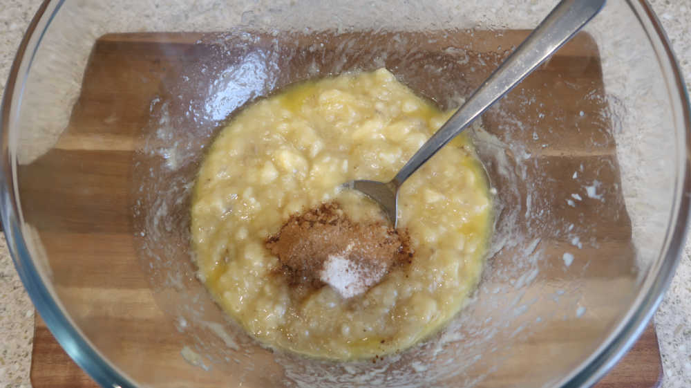 Adding sugar, baking soda, salt and cinnamon to the almond flour banana bread batter