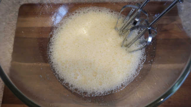 Whisking ingredients together for the cream cheese brownies