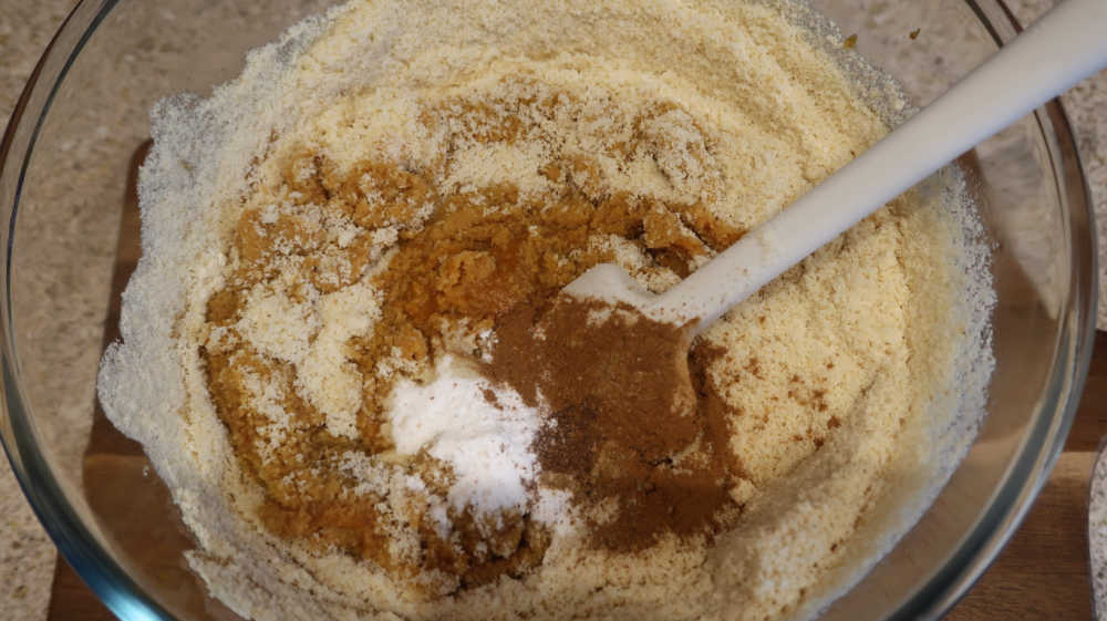 Adding the almond flour and spices to the batter