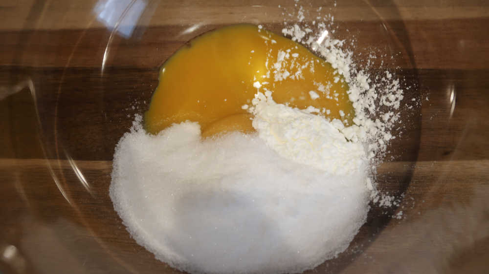Combining ingredients including corn flour together in a bowl